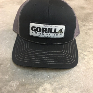 Gorilla Ammunition Woven Label Trucker Hat (Color: Black, Gray Mesh)
